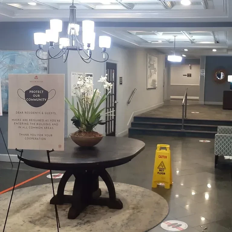 Seminary Towers lobby entrance with orchid arrangement